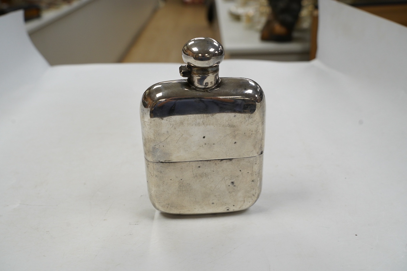 A George V silver hip flask, by Charles S. Green & Co, Birmingham, 1917, 14.5cm. Condition - poor